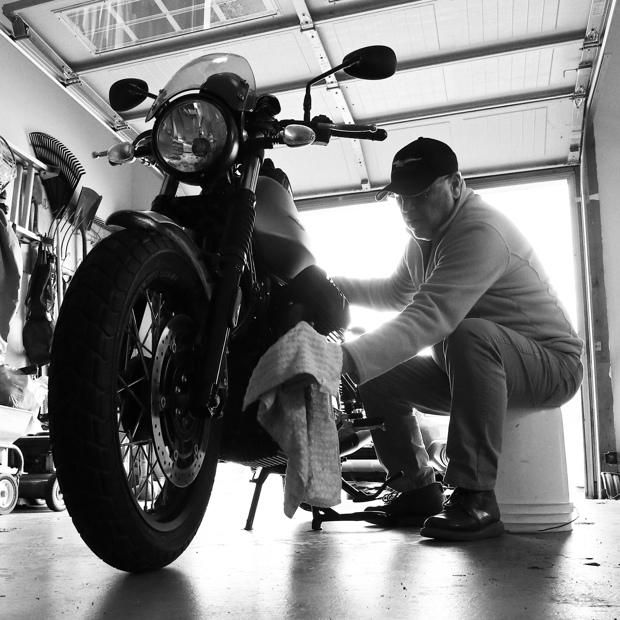 Brent Miller wiping down the 2020Moto Guzzi V7iiii Rough.